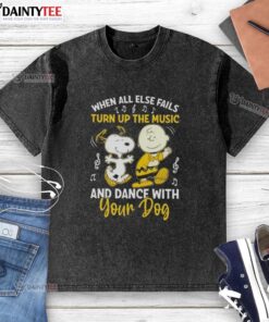 Charlie Brown and Snoopy dancing together on a washed t-shirt, perfect for dog lovers and music enthusiasts.