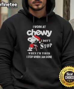 Snoopy Christmas hoodie with 'I work at Chewy, I don't stop when I'm tired, I stop when I'm done' text design.