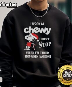 Alt Text: Cozy Christmas sweatshirt featuring Snoopy with the slogan I Work At Chewy, I Dont Stop When Im Tired.