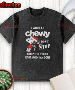 Funny Snoopy Christmas t-shirt with 'I work at Chewy, I dont stop when Im tired, I stop when Im done' slogan.