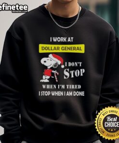 Alt Text: Snoopy Christmas sweatshirt featuring 'I work at Dollar General, I don't stop when I'm tired, I stop when I'm done.'