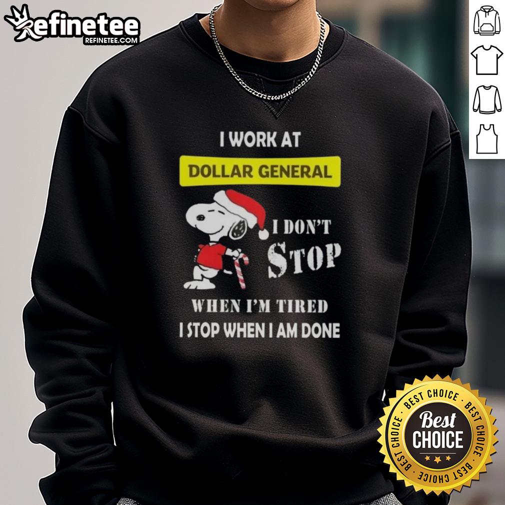 nice-snoopy-i-work-at-dollar-general-i-dont-stop-when-im-tired-i-stop-when-i-am-done-christmas-sweatshirt Alt Text: Snoopy Christmas sweatshirt featuring 'I work at Dollar General, I don't stop when I'm tired, I stop when I'm done.'