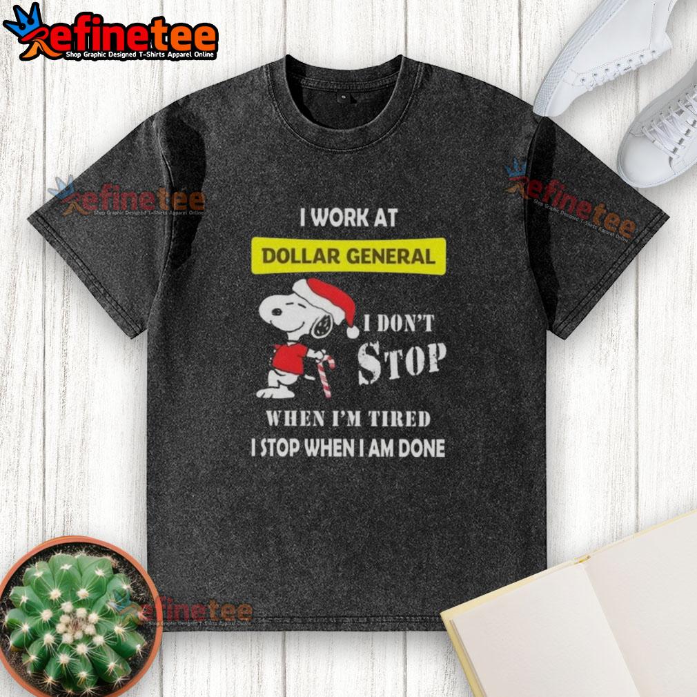 nice-snoopy-i-work-at-dollar-general-i-dont-stop-when-im-tired-i-stop-when-i-am-done-christmas-washed-t-shirt Alt Text: Snoopy graphic on a Christmas t-shirt reading 'I work at Dollar General, I don't stop when I'm tired, I stop when I'm done.'