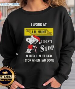 Christmas sweatshirt featuring Snoopy with 'I work at J.B. Hunt, I don't stop when I'm tired, I stop when I'm done' quote.