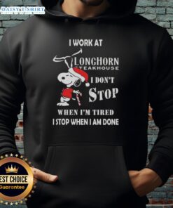 Alt Text: Snoopy Christmas hoodie with 'I work at Longhorn Steakhouse, I don't stop when I'm tired, I stop when I'm done' design.