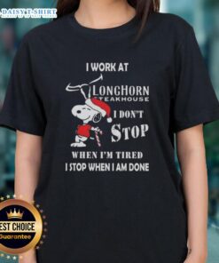 Cute Snoopy graphic on a ladies tee, featuring 'I work at Longhorn Steakhouse' and motivational quote for Christmas.
