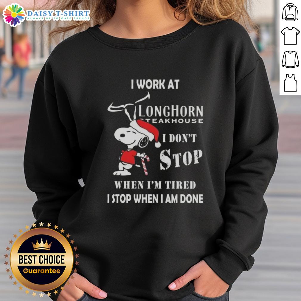 Nice Snoopy I Work At Longhorn Steakhouse I Don't Stop When I'm Tired I Stop When I Am Done Christmas Sweatshirt Snoopy Christmas sweatshirt for Longhorn Steakhouse featuring 'I don't stop when I'm tired, I stop when I'm done' quote.