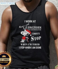 Alt Text: Snoopy Christmas tank top with I Work At Longhorn Steakhouse and motivational quote for holiday spirit.