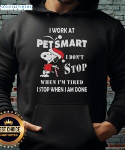 Cozy Snoopy Christmas hoodie saying 'I work at PetSmart, I don't stop when I'm tired, I stop when I'm done.'