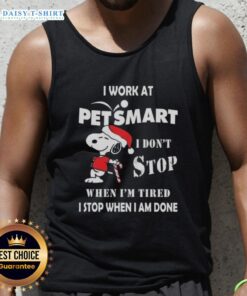 Christmas tank top featuring Snoopy with the phrase 'I work at PetSmart, I dont stop when Im tired, I stop when Im done.'