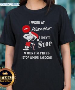 Christmas ladies tee featuring Snoopy with 'I work at Pizza Hut' and motivational quote about hard work.