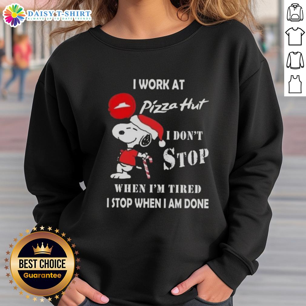 Nice Snoopy I Work At Pizza Hut I Don't Stop When I'm Tired I Stop When I Am Done Christmas Sweatshirt Cozy Christmas sweatshirt featuring Snoopy with the phrase 'I work at Pizza Hut, I don't stop when I'm tired'.
