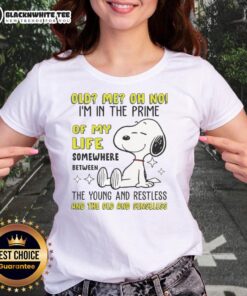 Alt Text: Cute Snoopy graphic tee featuring 'Oh No, I'm in the Prime of My Life' text, perfect for young and restless ladies.