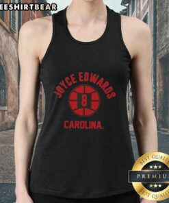 Joyce Edwards poses in a stylish tank top, showcasing South Carolina basketball pride in a vibrant setting.