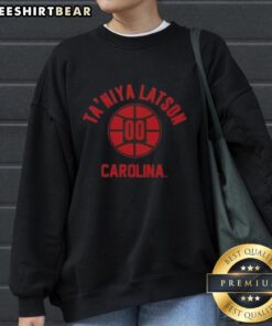 Alt Text: Taniya Latson poses in a stylish sweatshirt featuring Nice South Carolina Basketball design, showcasing team spirit.