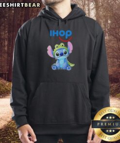 Cosplayer wearing a Nice Stitch Crocodile x IHOP hoodie, showcasing vibrant colors and unique design in a playful setting.