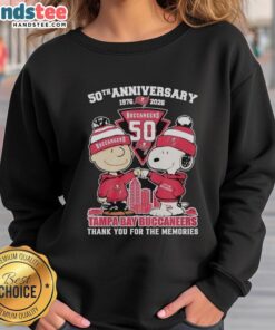 Nice Tampa Bay Buccaneers outfit featuring Snoopy and Charlie Brown 50th Anniversary sweatshirt, 1976-2026.
