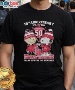 Stylish Tampa Bay Buccaneers outfit featuring a Snoopy and Charlie Brown 50th Anniversary T-shirt from 1976 to 2026.