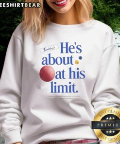 Man wearing 'He's About At His Limit' sweatshirt from Nice The Chair Company, showcasing casual fashion with a humorous twist.