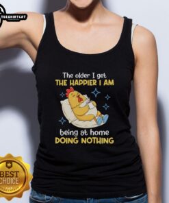 Alt Text: Woman wearing 'The Older I Get The Happier I Am Being At Home Doing Nothing' tank top, relaxed at home.