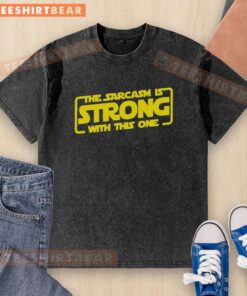 Funny sarcastic washed t-shirt featuring bold text 'The Sarcasm Is Strong With This One' in a casual style.