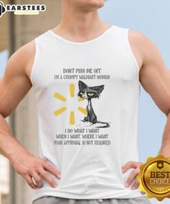 Grumpy woman in a tank top with a cat, showcasing a playful Don't piss me off attitude at Walmart. Perfect for humor lovers.
