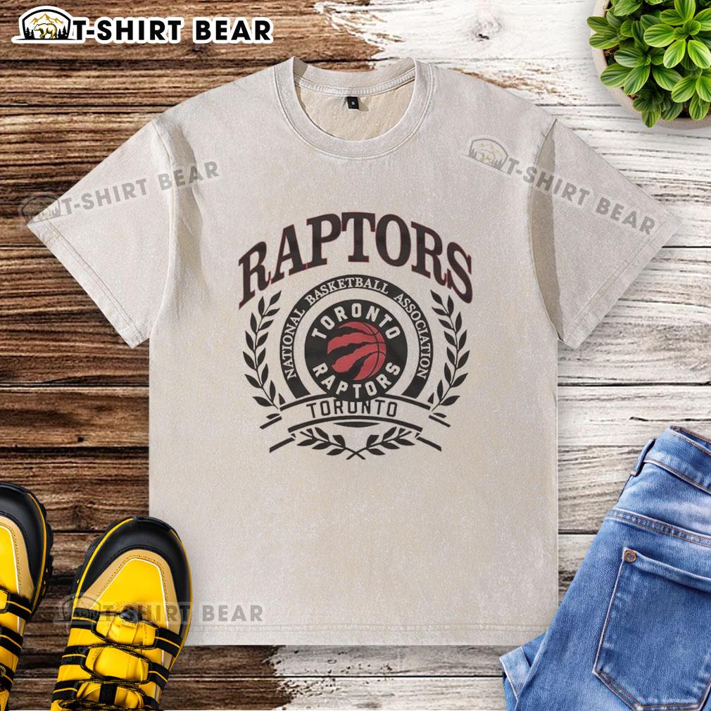 Nice Toronto Raptors National Basketball Association Logo Laurel Wreath Frame Retro Washed T-Shirt Retro washed t-shirt featuring the Toronto Raptors NBA logo framed by a laurel wreath, perfect for basketball fans.