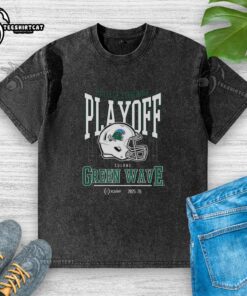 Alt Text: Tulane Green Wave NCAA 2025-2026 College Football Playoff curved helmet design on a washed t-shirt.