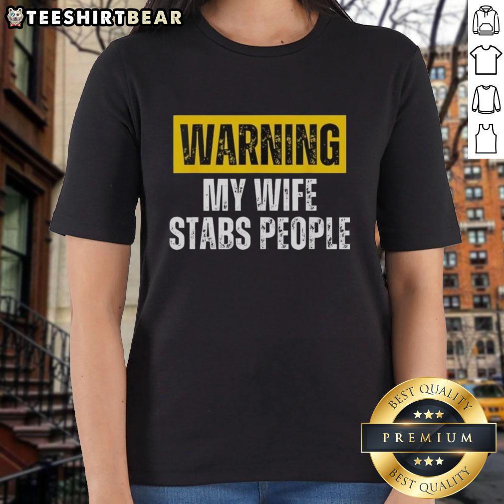 nice-warning-my-wife-stabs-people-vintage-ladies-tee Alt Text: Vintage ladies tee featuring a humorous warning: My wife stabs people for a fun, edgy fashion statement.