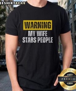 Vintage T-Shirt with 'Nice Warning My Wife Stabs People' graphic, perfect for humor lovers and quirky fashion enthusiasts.