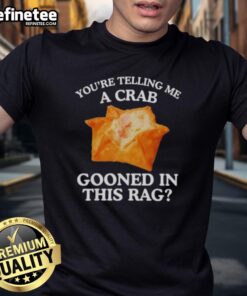 Alt Text: Crab wearing a rag T-shirt with the phrase 'Nice You Are Telling Me' printed on it, showcasing unique beach fashion.