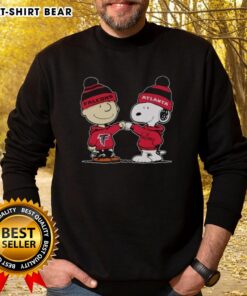 Official Atlanta Falcons Snoopy and Charlie Brown Best Friends Sweatshirt featuring vibrant graphics for fans.
