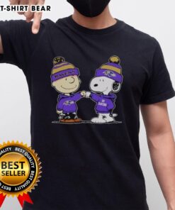 Alt Text: Official Baltimore Ravens Snoopy and Charlie Brown Best Friends T-Shirt featuring iconic cartoon characters in team colors.
