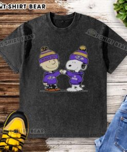 Alt Text: Official Baltimore Ravens Snoopy and Charlie Brown Best Friends washed t-shirt showcasing vibrant team colors and graphics.