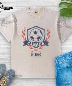 Official Canada 2026 Vintage Soccer Crest Washed T-Shirt featuring a classic design and vibrant colors for soccer fans.