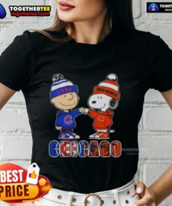 Alt Text: Official Charlie Brown fist bump with Snoopy, featuring Chicago City Sports Cubs x Bears ladies tee design.