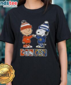 Official Charlie Brown fist bump with Snoopy on a Denver City Sports Broncos x Nuggets ladies tee design.