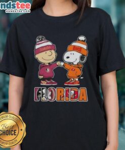 Official Charlie Brown Fist Bump tee featuring Snoopy, perfect for Florida City sports fans, Seminoles & Buccaneers.