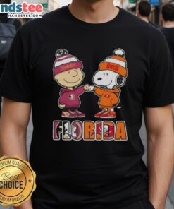 Official Charlie Brown fist bump Snoopy T-shirt featuring Florida City Sports, Seminoles, and Tampa Bay Buccaneers logos.