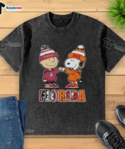 Official Charlie Brown fist bump with Snoopy on Florida City sports Seminoles and Tampa Bay Buccaneers washed t-shirt.