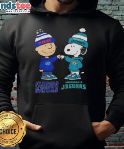 Official Charlie Brown fist bump hoodie featuring Snoopy, Florida Gators, and Jacksonville Jaguars logo design.