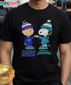 Official Charlie Brown Fist Bump Snoopy T-Shirt featuring Florida Gators and Jacksonville Jaguars design.