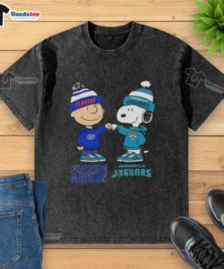 Alt Text: Official Charlie Brown fist bump with Snoopy on a Florida Gators x Jacksonville Jaguars washed t-shirt.