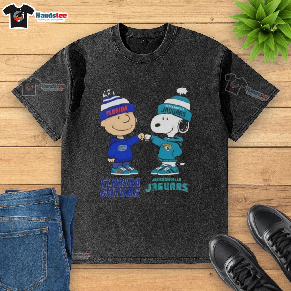official-charlie-brown-fist-bump-snoopy-florida-gators-x-jacksonville-jaguars-washed-t-shirt Alt Text: Official Charlie Brown fist bump with Snoopy on a Florida Gators x Jacksonville Jaguars washed t-shirt.