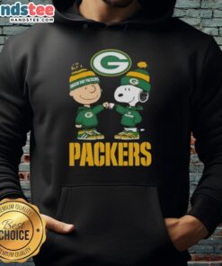 Alt Text: Official Charlie Brown fist bump with Snoopy on a Green Bay Packers hoodie, perfect for fans and cozy wear.