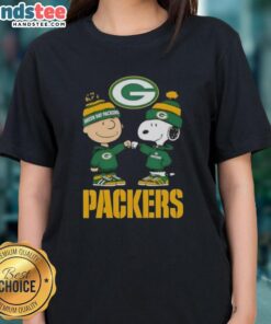 Official Charlie Brown fist bump with Snoopy on a Green Bay Packers ladies tee celebrating fandom and style.
