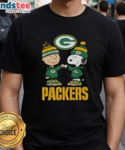 Official Charlie Brown Fist Bump Snoopy Green Bay Packers T-Shirt featuring vibrant graphics and team colors.