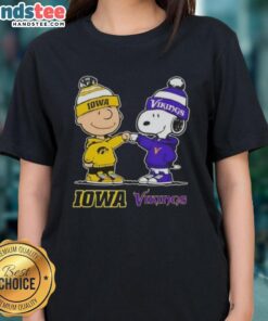 Official Charlie Brown fist bump with Snoopy on Iowa Hawkeyes x Minnesota Vikings ladies tee design.