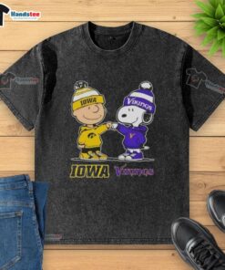 Alt Text: Official Charlie Brown fist bump with Snoopy on Iowa Hawkeyes x Minnesota Vikings washed t-shirt design.