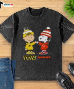 Official Charlie Brown fist bump with Snoopy on Iowa Hawks x Chicago Bears washed t-shirt, perfect for fans.
